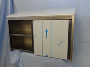 Wall cabinet with sloping roof