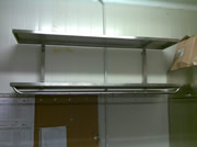 Two-row wall shelf with the addition of hanging utensils
