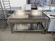 Inox open table with edge and three drawers underneath the worktop